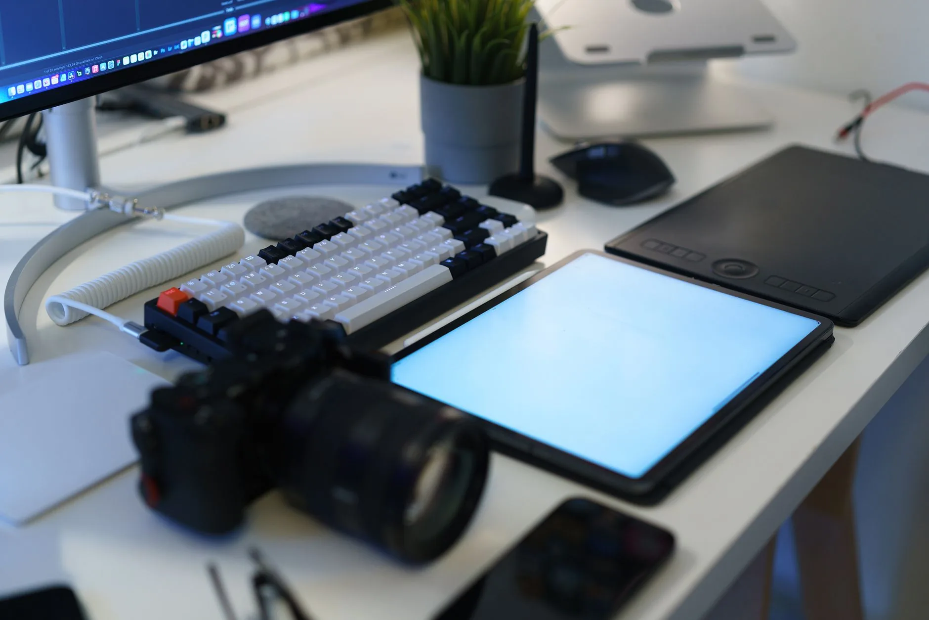Person using PECS for Autism app on tablet at desk, soft lighting, muted colors.