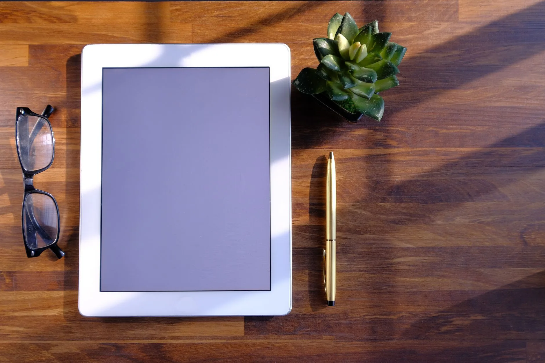 AAC layout on tablet with customizable word boards, muted colors, soft lighting.